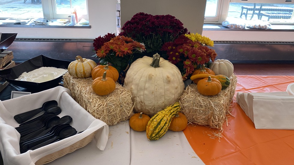 pumpkins and flowers on a table